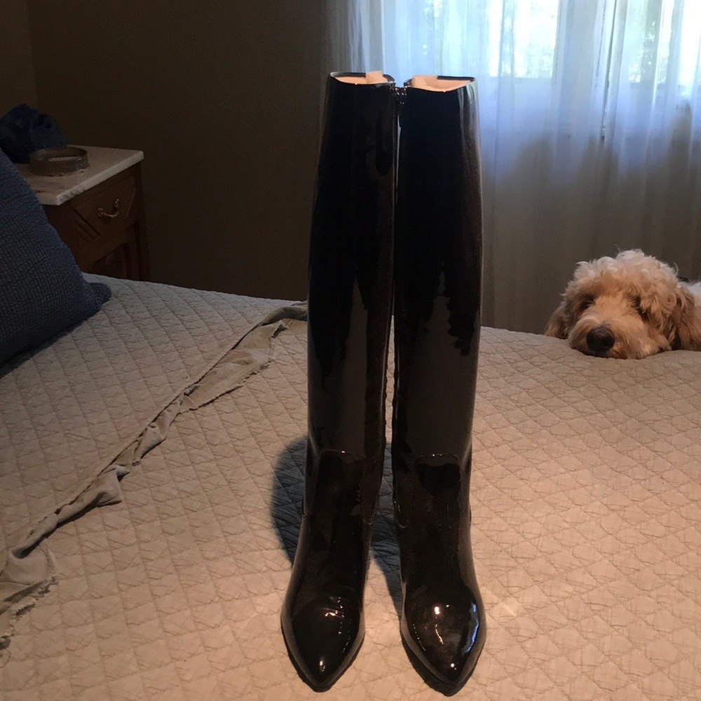 Tall black patten leather boots